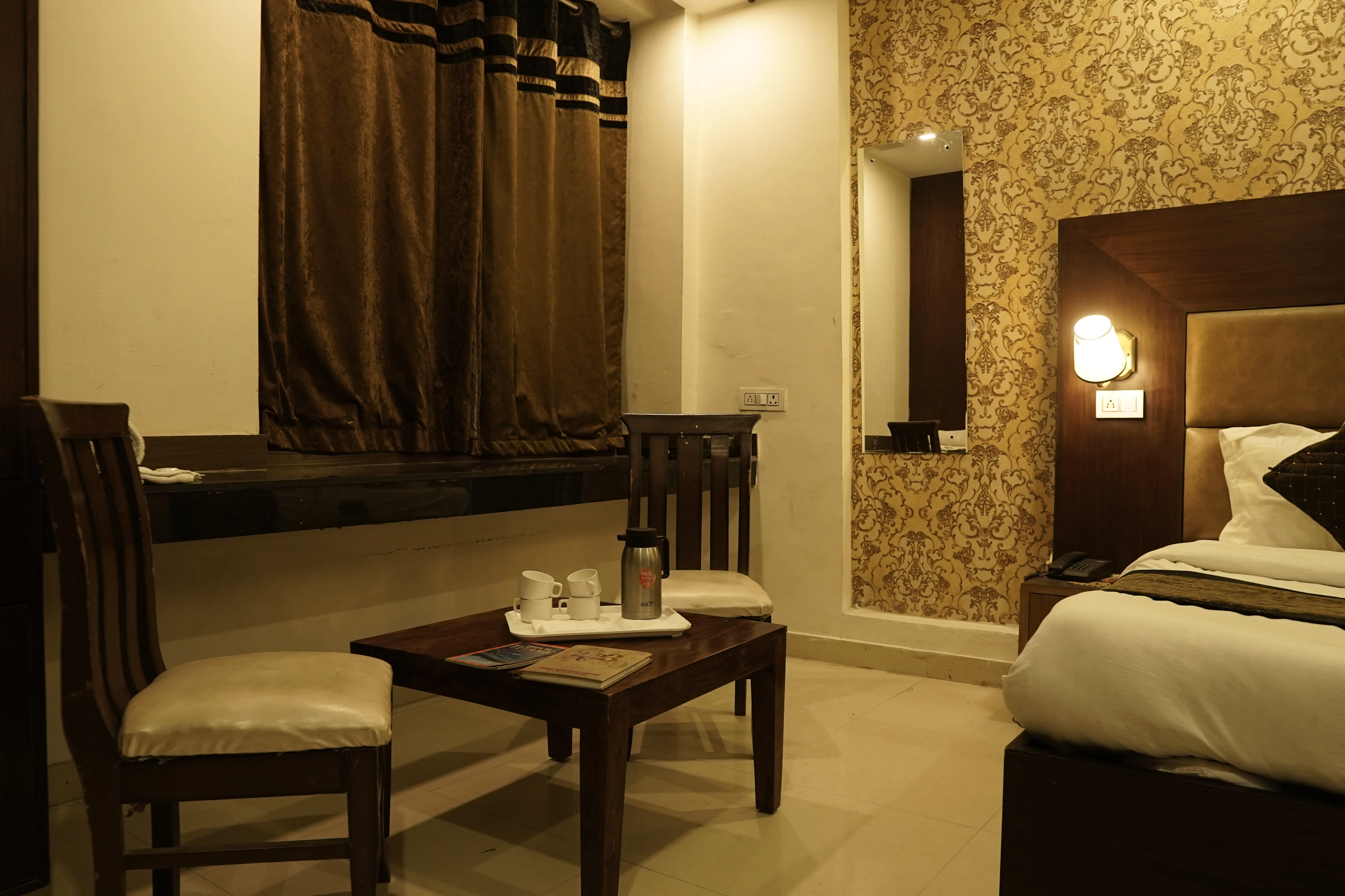 Super Deluxe Room with 43-inch Smart TV and plush seating